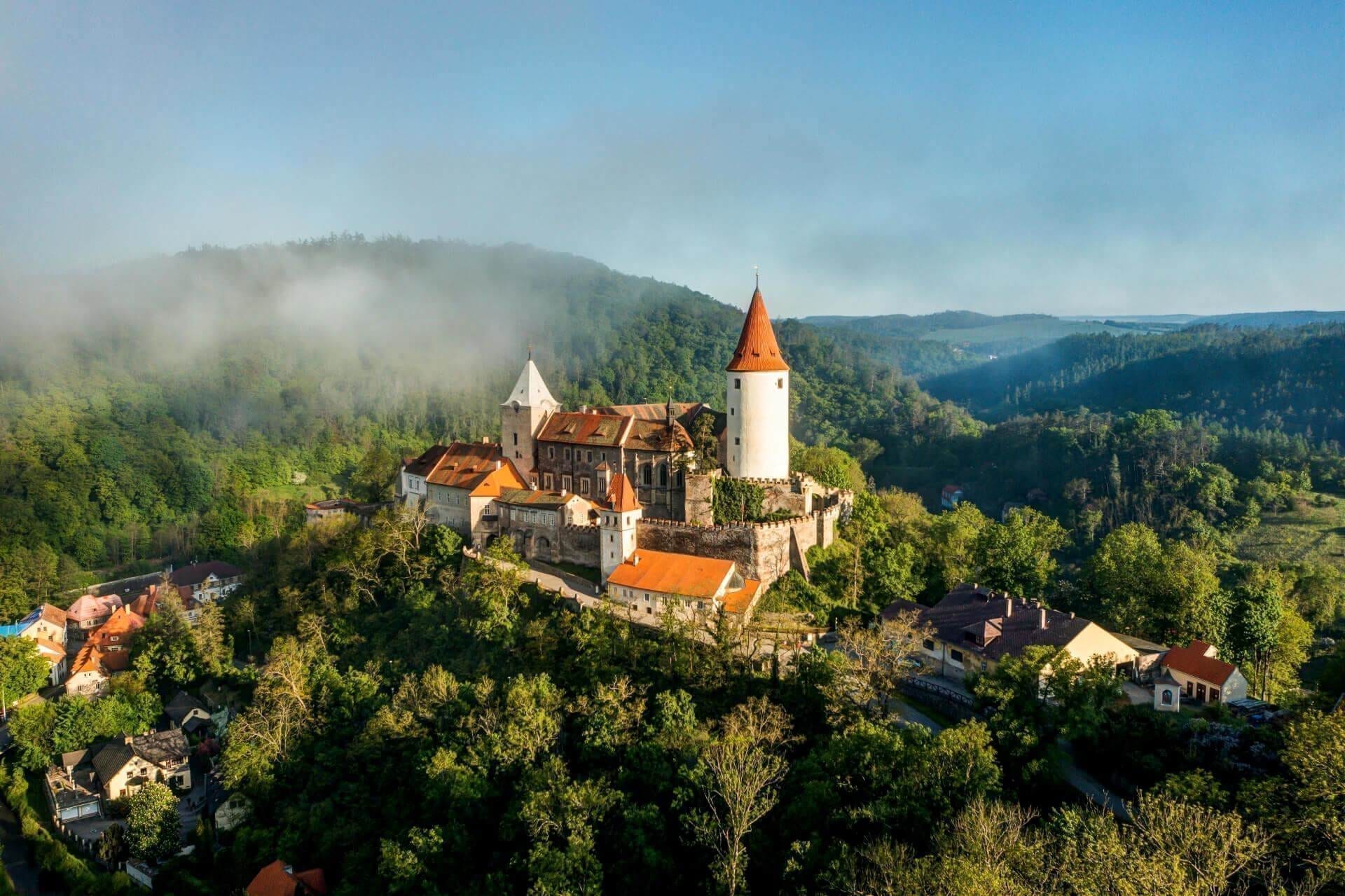 The imposing Křivoklát Castle, the 'Stone Heart of Bohemia', viewed from a distance.